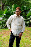 Model wearing Benicio Barong Tagalog in cream organza with traditional embroidery