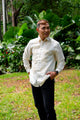 Model wearing Benicio Barong Tagalog in cream organza with traditional embroidery