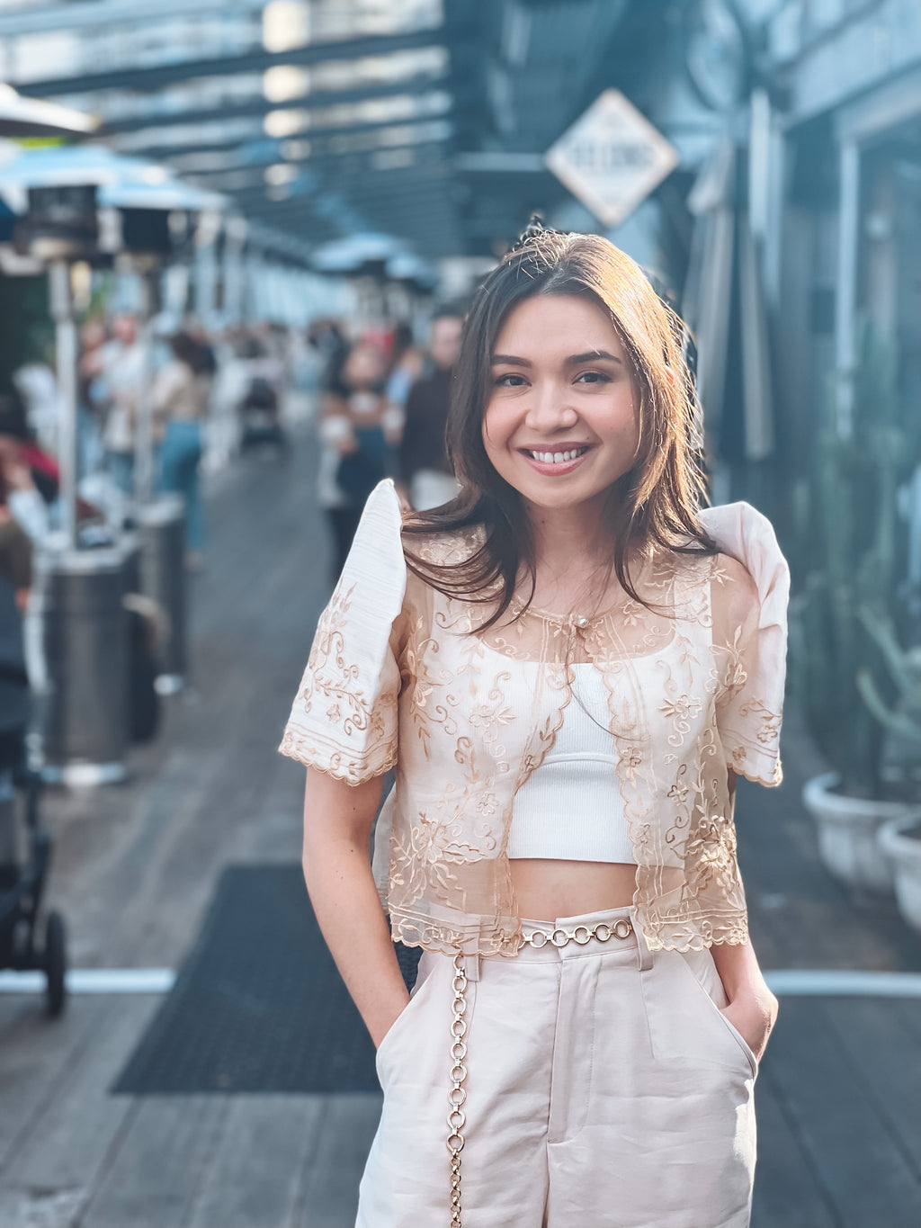 Model wearing Carmen Bolero in cream with traditional Filipino styling