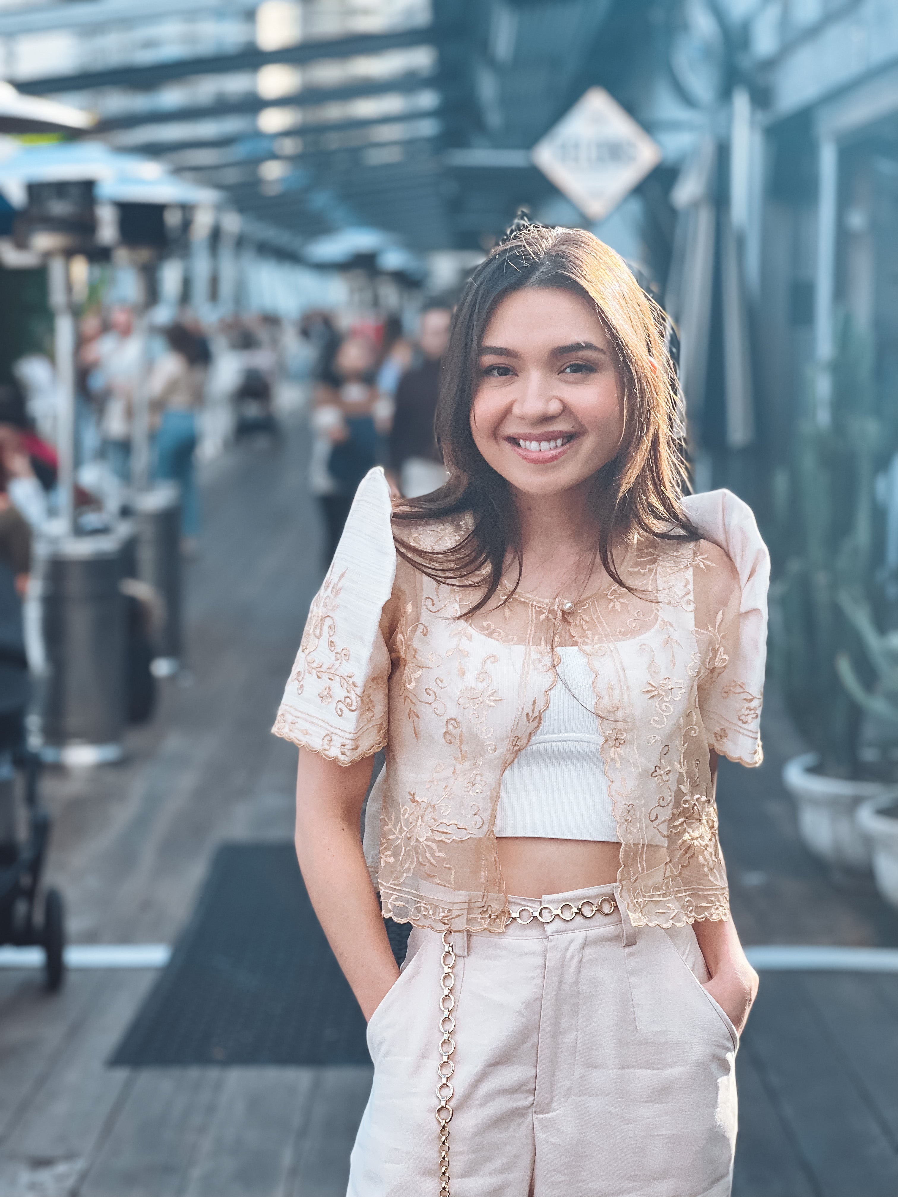 Model wearing Carmen Bolero in cream with traditional Filipino styling